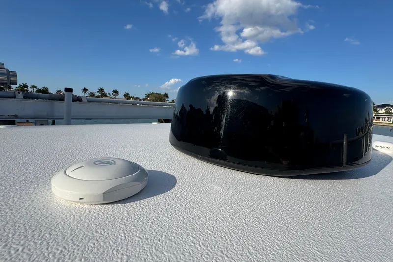 High Steaks Yacht Photos Pics 2024 Jupiter 38 HFS boat with radar and GPS equipment under a clear blue sky.