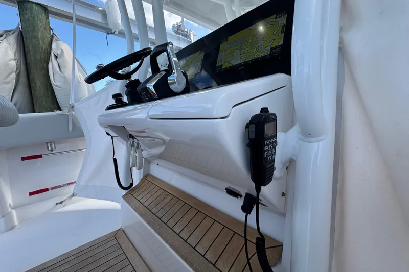 High Steaks Yacht Photos Pics 2024 Jupiter 38 HFS boat helm with navigation display and communication equipment.