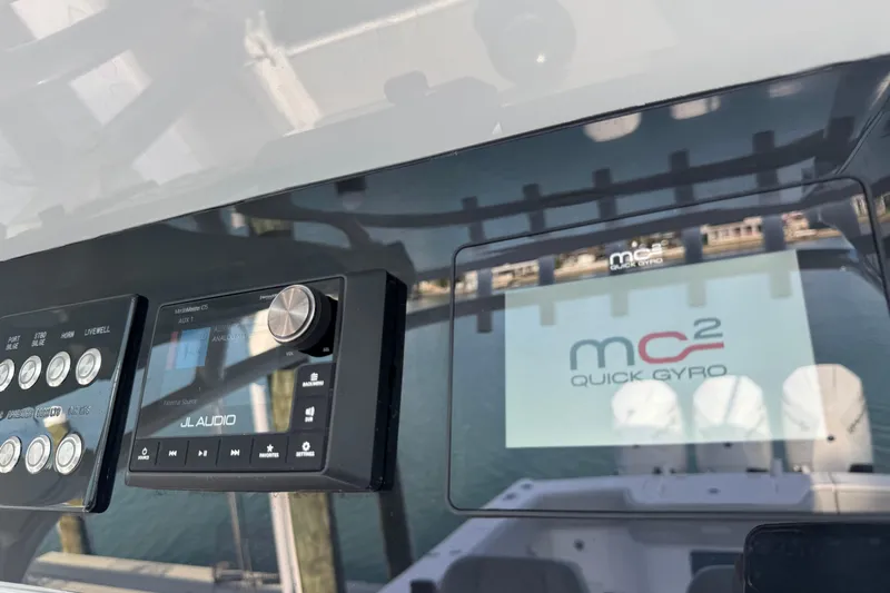 High Steaks Yacht Photos Pics 2024 Jupiter 38 HFS dashboard featuring JL Audio system and MC&sup2; Quick Gyro display.
