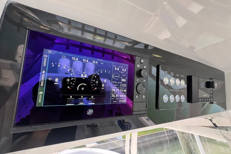 High Steaks Yacht Photos Pics 2024 Jupiter 38 HFS boat dashboard with digital display and control panel.