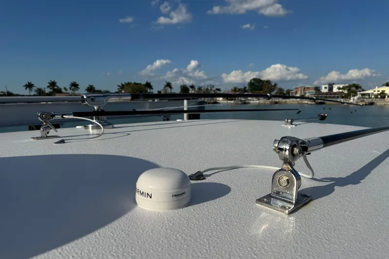 High Steaks Yacht Photos Pics 2024 Jupiter 38 HFS boat deck with antennas and Garmin device, under clear blue sky.