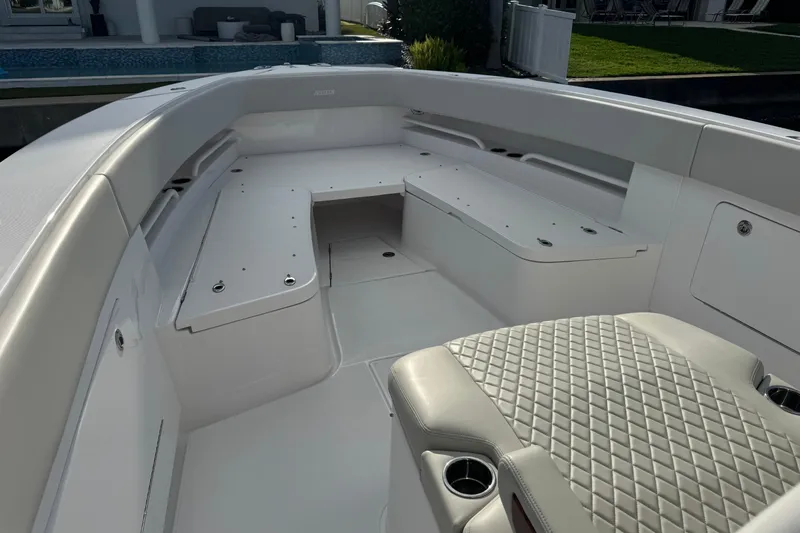 High Steaks Yacht Photos Pics 2024 Jupiter 38 HFS boat interior with cushioned seating and storage compartments.