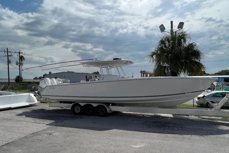 High Steaks Yacht Photos Pics 2024 Jupiter 38 HFS boat on trailer under cloudy sky.