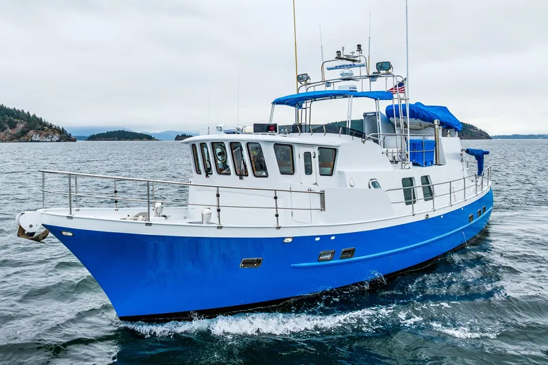 Single Star Yacht Photos Pics 1978 Hidden Harbor Custom Trawler cruising on open water, featuring a blue and white design.