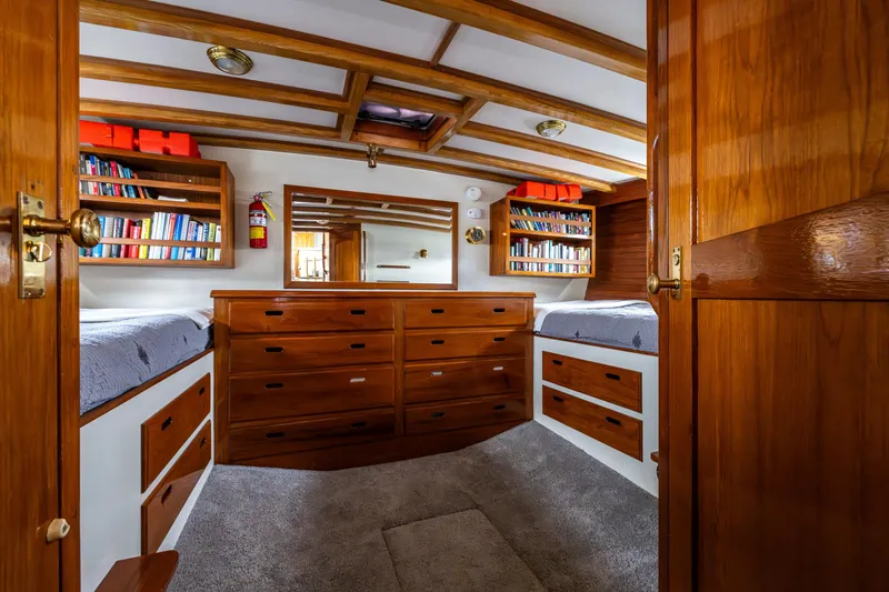 Single Star Yacht Photos Pics 1978 Hidden Harbor Custom Trawler cabin with wooden interior, bookshelves, and twin beds.