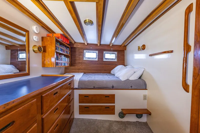 Single Star Yacht Photos Pics Cozy 1978 Hidden Harbor Custom Trawler cabin with wooden accents and built-in storage.