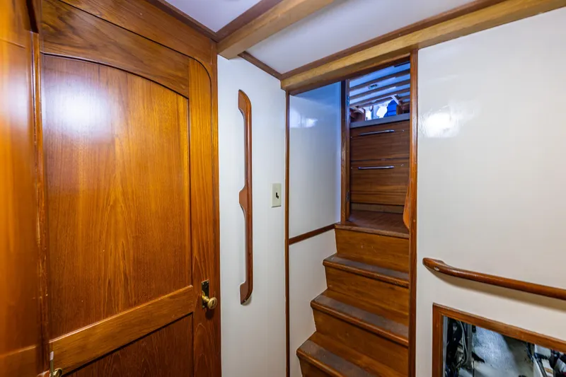Single Star Yacht Photos Pics Interior of 1978 Hidden Harbor Custom Trawler with wooden stairs and door.