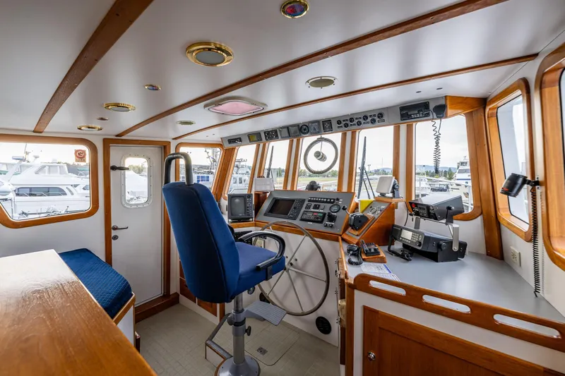 Single Star Yacht Photos Pics Interior of 1978 Hidden Harbor Custom Trawler with navigation equipment and captain's chair.