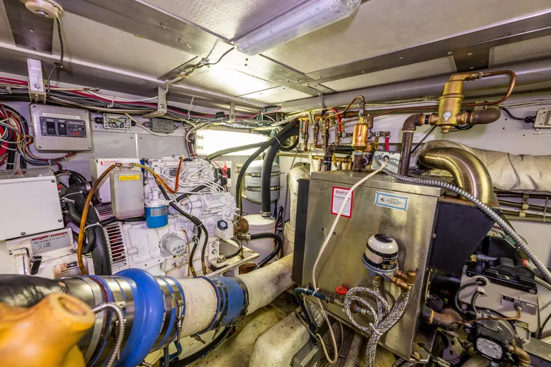 Single Star Yacht Photos Pics Engine room of a 1978 Hidden Harbor Custom Trawler, showcasing complex machinery and wiring.