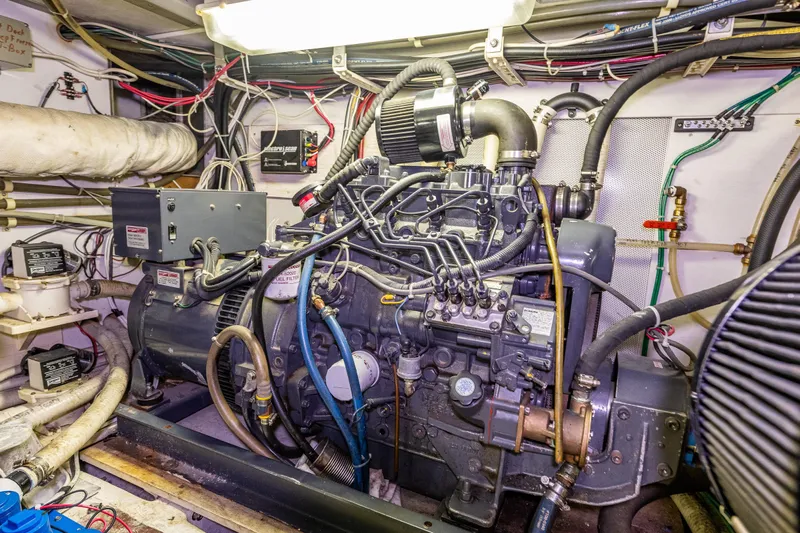 Single Star Yacht Photos Pics Engine room of a 1978 Hidden Harbor Custom Trawler, showcasing detailed machinery and wiring.