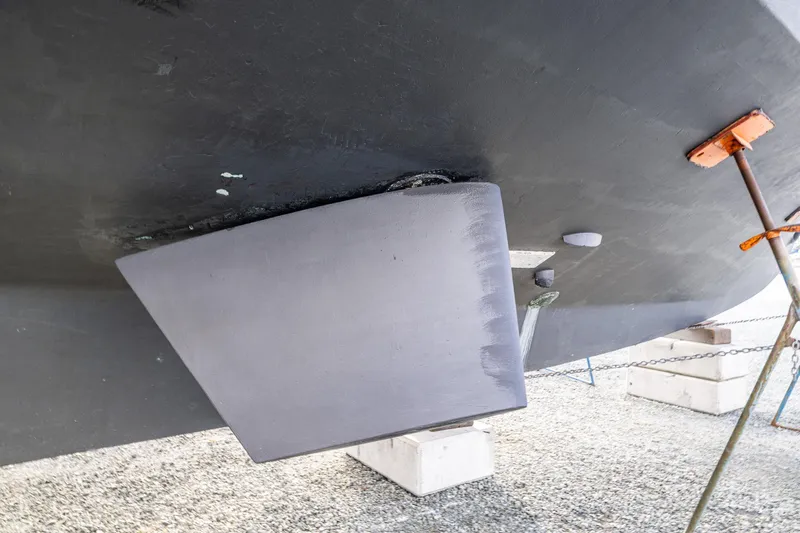 Single Star Yacht Photos Pics 1978 Hidden Harbor Custom Trawler hull detail on dry dock, showcasing rudder and support structures.