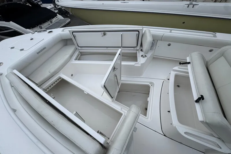  Yacht Photos Pics 2019 Everglades 273 Center Console boat interior with open storage compartments.