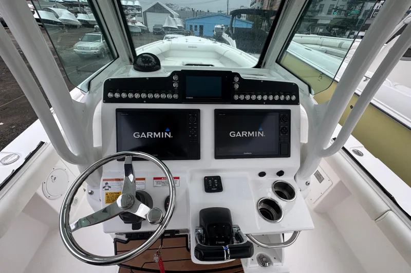  Yacht Photos Pics 2019 Everglades 273 Center Console boat dashboard with Garmin navigation displays.