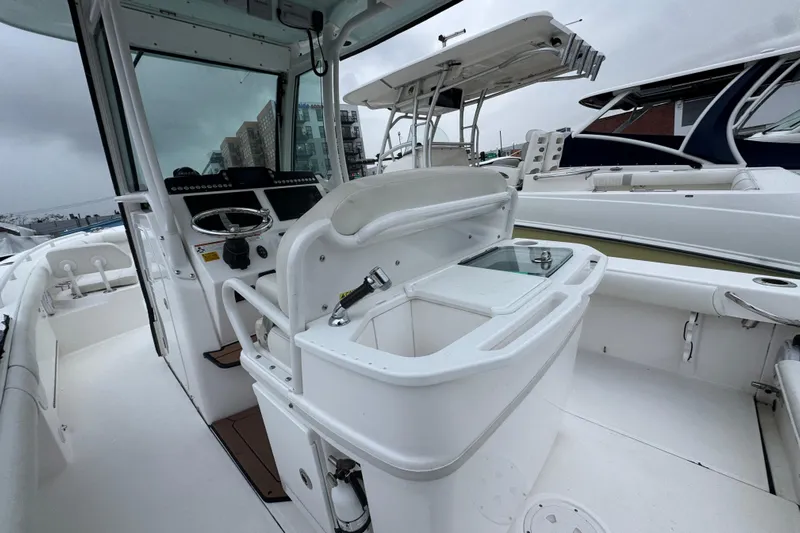  Yacht Photos Pics 2019 Everglades 273 Center Console boat interior with steering wheel and seating.