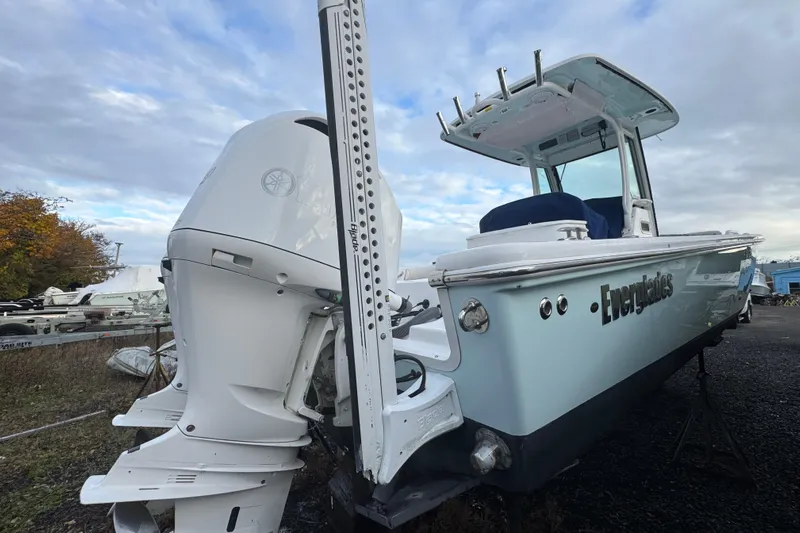  Yacht Photos Pics 2019 Everglades 273 Center Console boat with powerful outboard motor, docked outdoors.