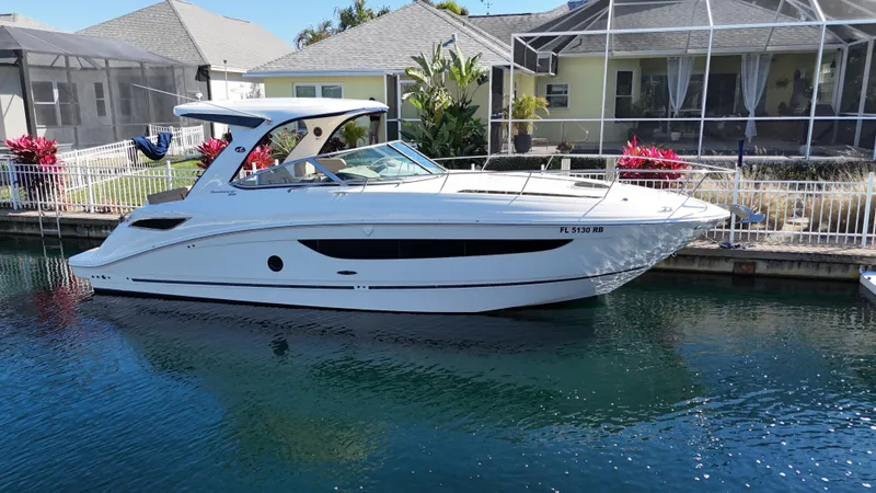  Yacht Photos Pics 2016 Sea Ray 350 Sundancer yacht docked near waterfront homes.
