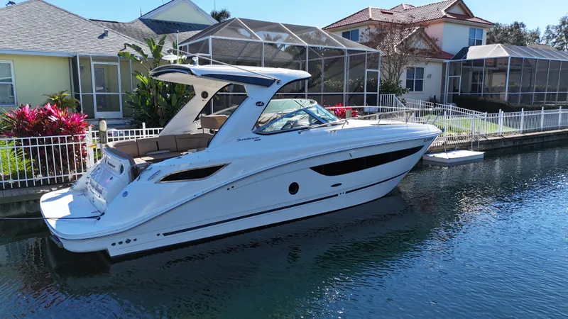  Yacht Photos Pics 2016 Sea Ray 350 Sundancer boat docked near waterfront homes.