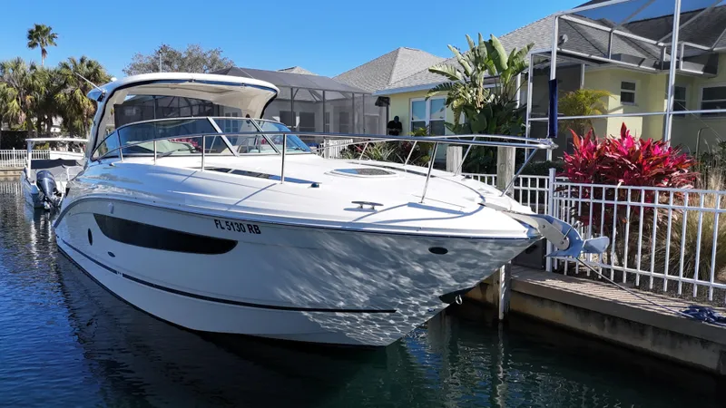  Yacht Photos Pics 2016 Sea Ray 350 Sundancer docked near waterfront homes.