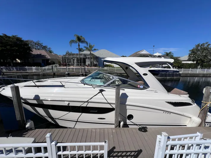  Yacht Photos Pics 2016 Sea Ray 350 Sundancer docked at a marina on a sunny day.