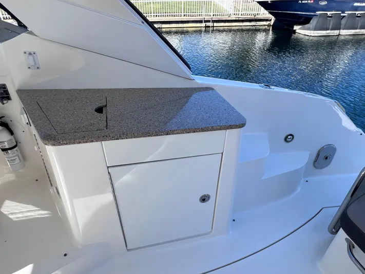  Yacht Photos Pics 2016 Sea Ray 350 Sundancer cockpit with countertop and storage cabinet.