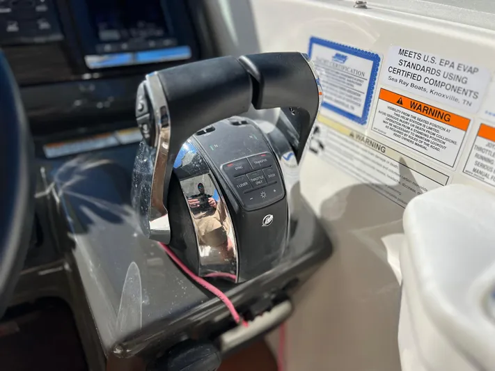  Yacht Photos Pics Close-up of 2016 Sea Ray 350 Sundancer throttle controls and warning labels.