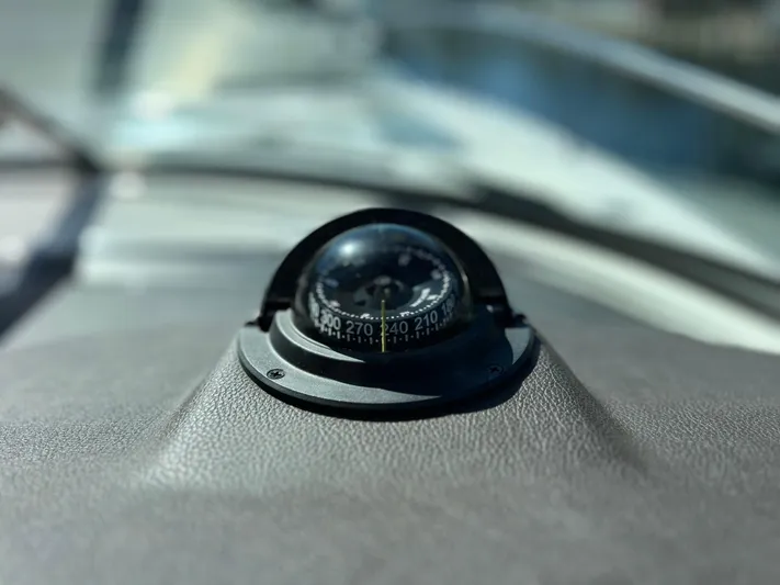  Yacht Photos Pics Compass on the dashboard of a 2016 Sea Ray 350 Sundancer boat.