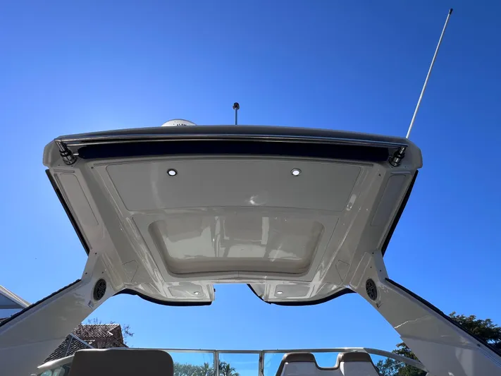  Yacht Photos Pics 2016 Sea Ray 350 Sundancer boat canopy against clear blue sky.