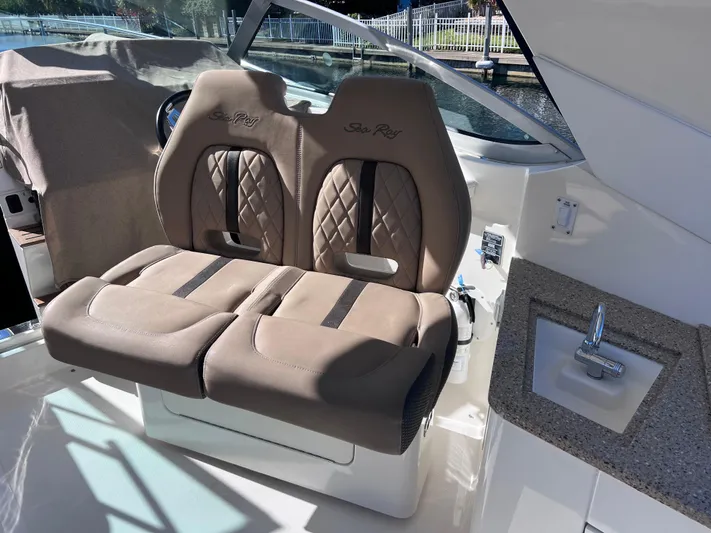  Yacht Photos Pics 2016 Sea Ray 350 Sundancer cockpit with dual captain's chairs and sink.