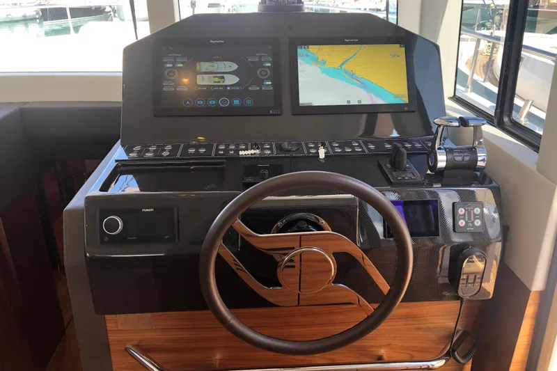  Yacht Photos Pics Helm of 2020 Sundeck Yachts 580 with navigation screens and controls.