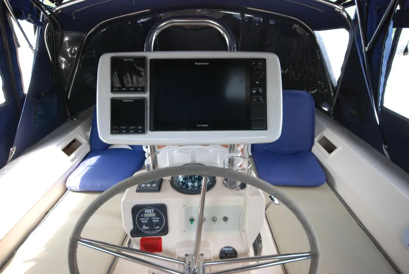 Priva Sea Yacht Photos Pics Cockpit of 2003 Island Packet 485 sailboat with navigation equipment and blue seating.
