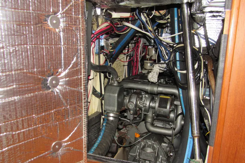 Priva Sea Yacht Photos Pics Engine compartment of a 2003 Island Packet 485 sailboat, showcasing wiring and mechanical components.