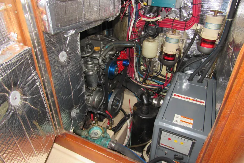 Priva Sea Yacht Photos Pics Engine room of 2003 Island Packet 485 sailboat, featuring mechanical components and wiring.