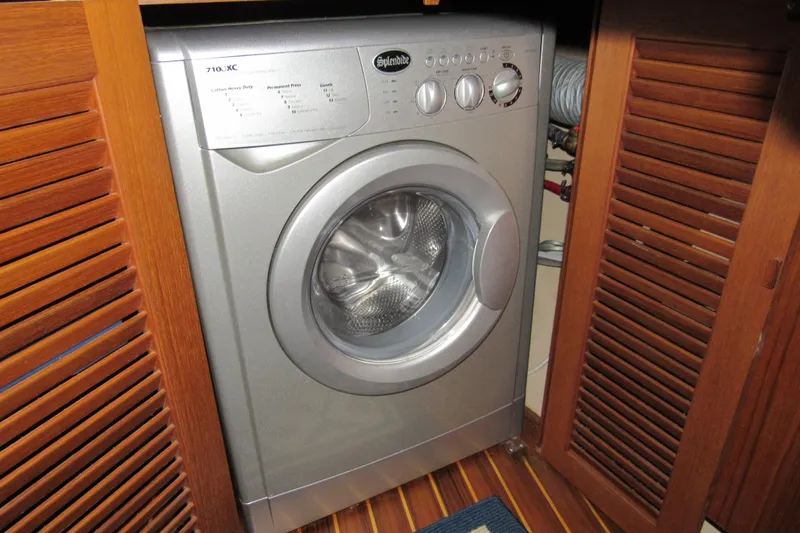 Priva Sea Yacht Photos Pics Washing machine in wooden cabinet on Island Packet 485 yacht, 2003 model.