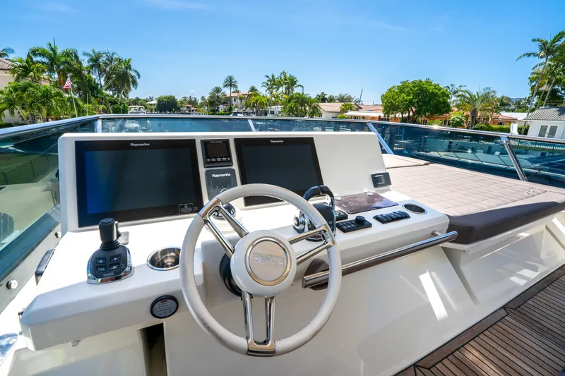  Yacht Photos Pics Cockpit of 2018 Prestige 680 yacht with modern navigation equipment and luxurious seating.