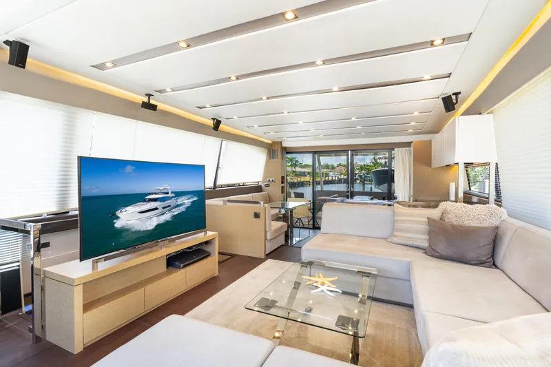  Yacht Photos Pics Luxurious interior of 2018 Prestige 680 yacht with modern decor and large TV.