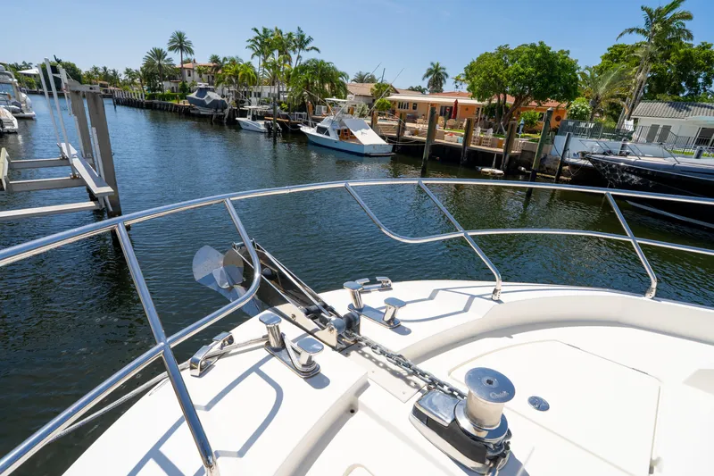  Yacht Photos Pics Bow view of 2018 Prestige 680 yacht docked in a sunny marina.