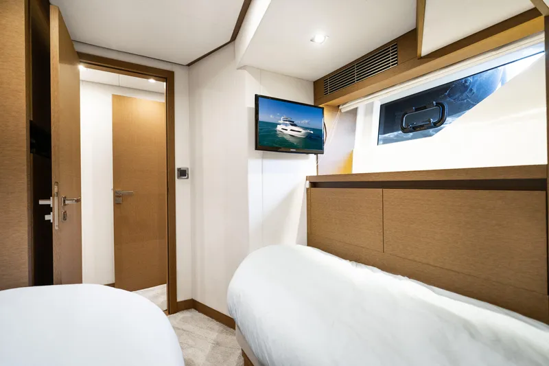  Yacht Photos Pics Luxurious cabin interior of 2018 Prestige 680 yacht with modern amenities.