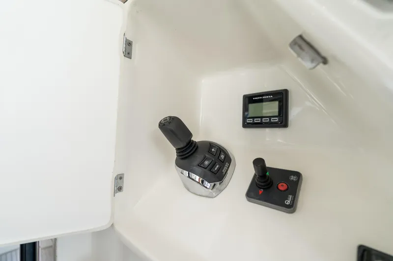  Yacht Photos Pics Control panel of a 2018 Prestige 680 yacht featuring joystick and display.