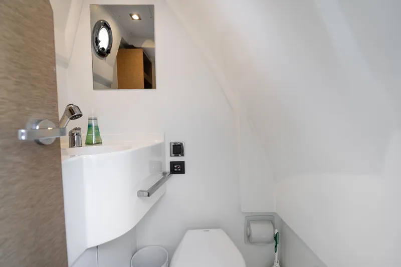  Yacht Photos Pics Luxurious bathroom interior of 2018 Prestige 680 yacht with modern fixtures and sleek design.