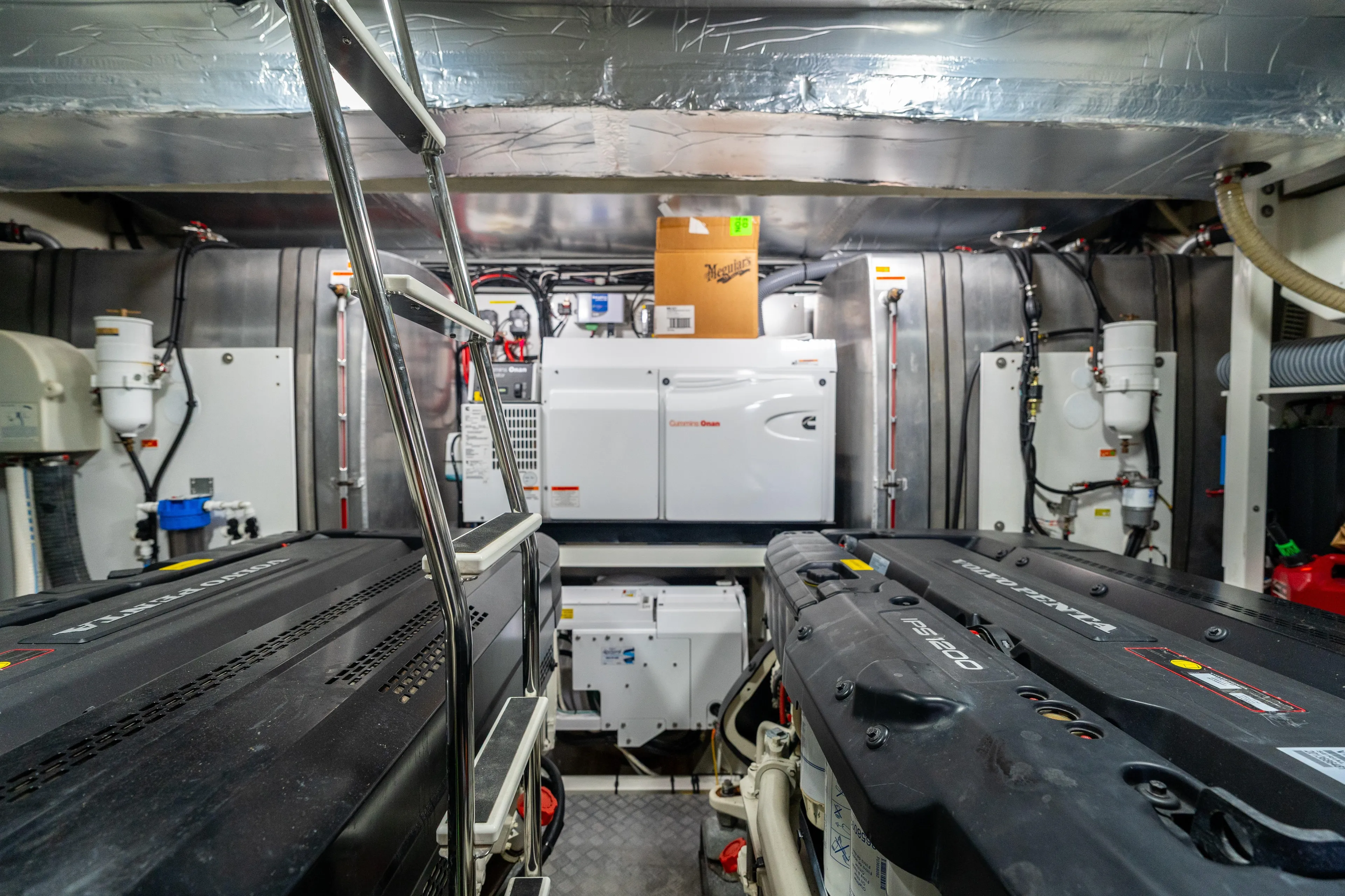  Yacht Photos Pics Engine room of a 2018 Prestige 680 yacht, featuring advanced machinery and equipment.