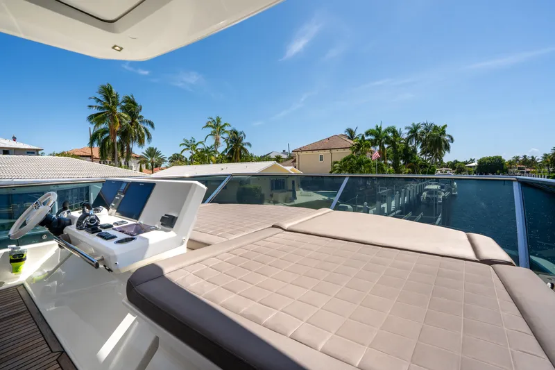  Yacht Photos Pics Flybridge of 2018 Prestige 680 yacht with helm station and sunbathing area.