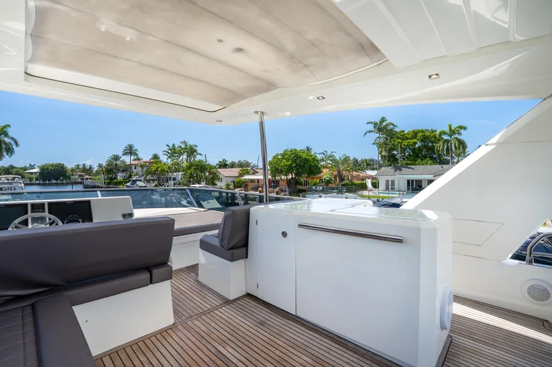  Yacht Photos Pics Luxurious 2018 Prestige 680 yacht interior with sleek seating and scenic waterfront view.