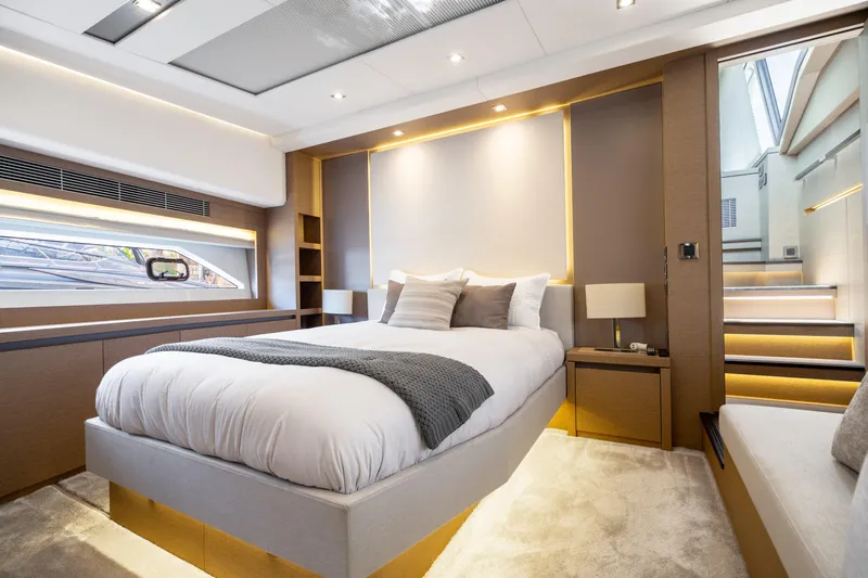  Yacht Photos Pics Luxurious bedroom interior of 2018 Prestige 680 yacht, featuring modern design and elegant lighting.