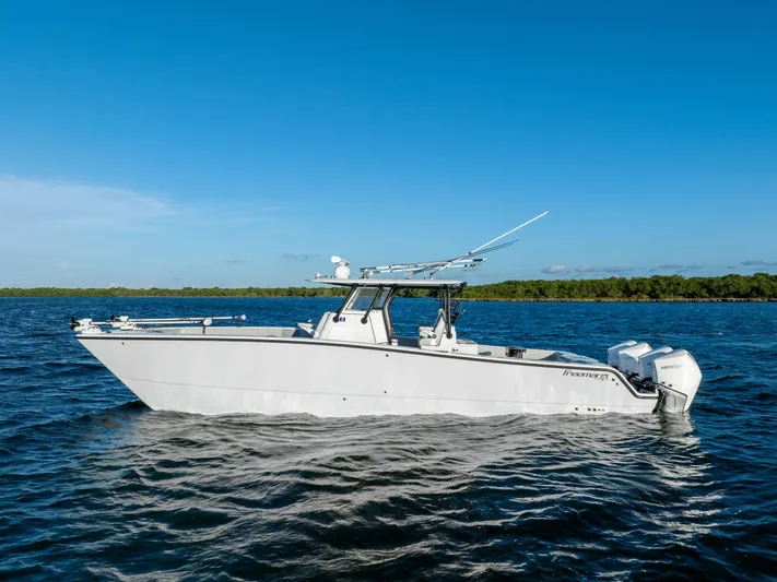  Yacht Photos Pics 2020 Freeman 37 VH boat on calm blue water under clear sky.