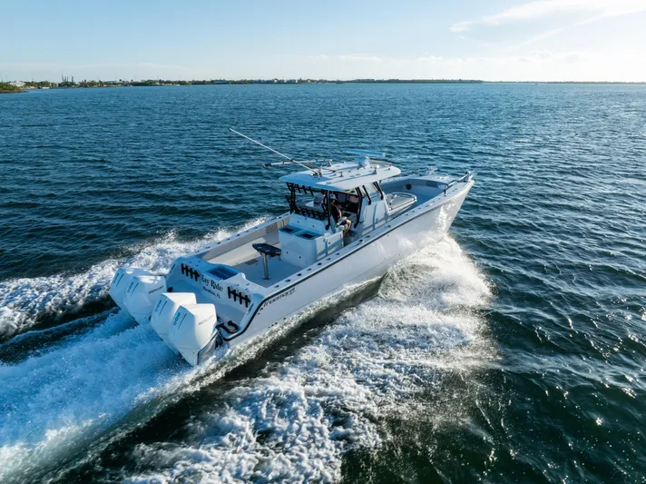  Yacht Photos Pics 2020 Freeman 37 VH boat cruising on open water, rear view.