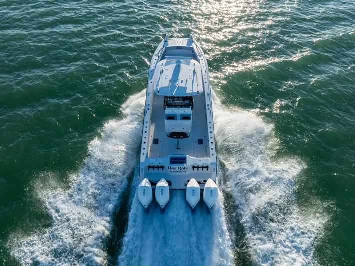  Yacht Photos Pics Freeman 37 VH 2020 boat cruising on open water, rear view.