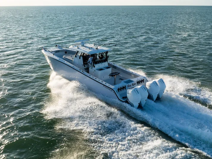  Yacht Photos Pics 2020 Freeman 37 VH boat cruising on open water, rear view with dual engines.