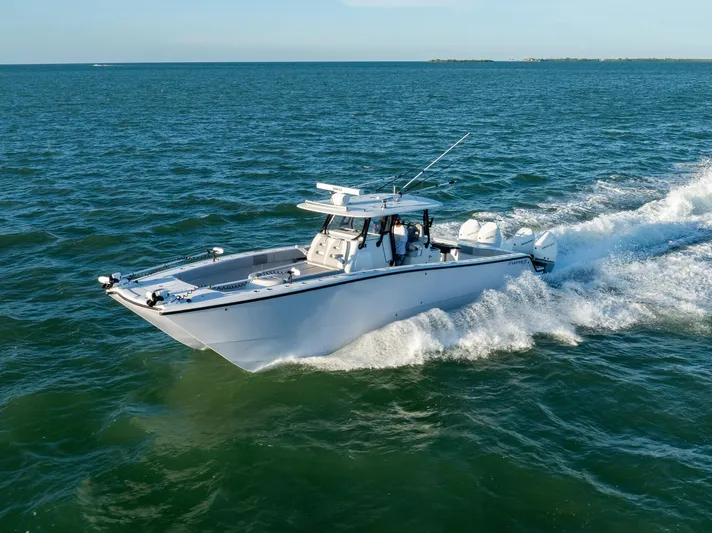  Yacht Photos Pics Freeman 37 VH 2020 boat cruising on open water, creating waves.