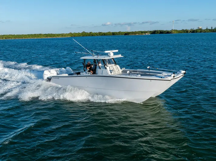  Yacht Photos Pics Freeman 37 VH 2020 boat cruising on open water under clear blue sky.