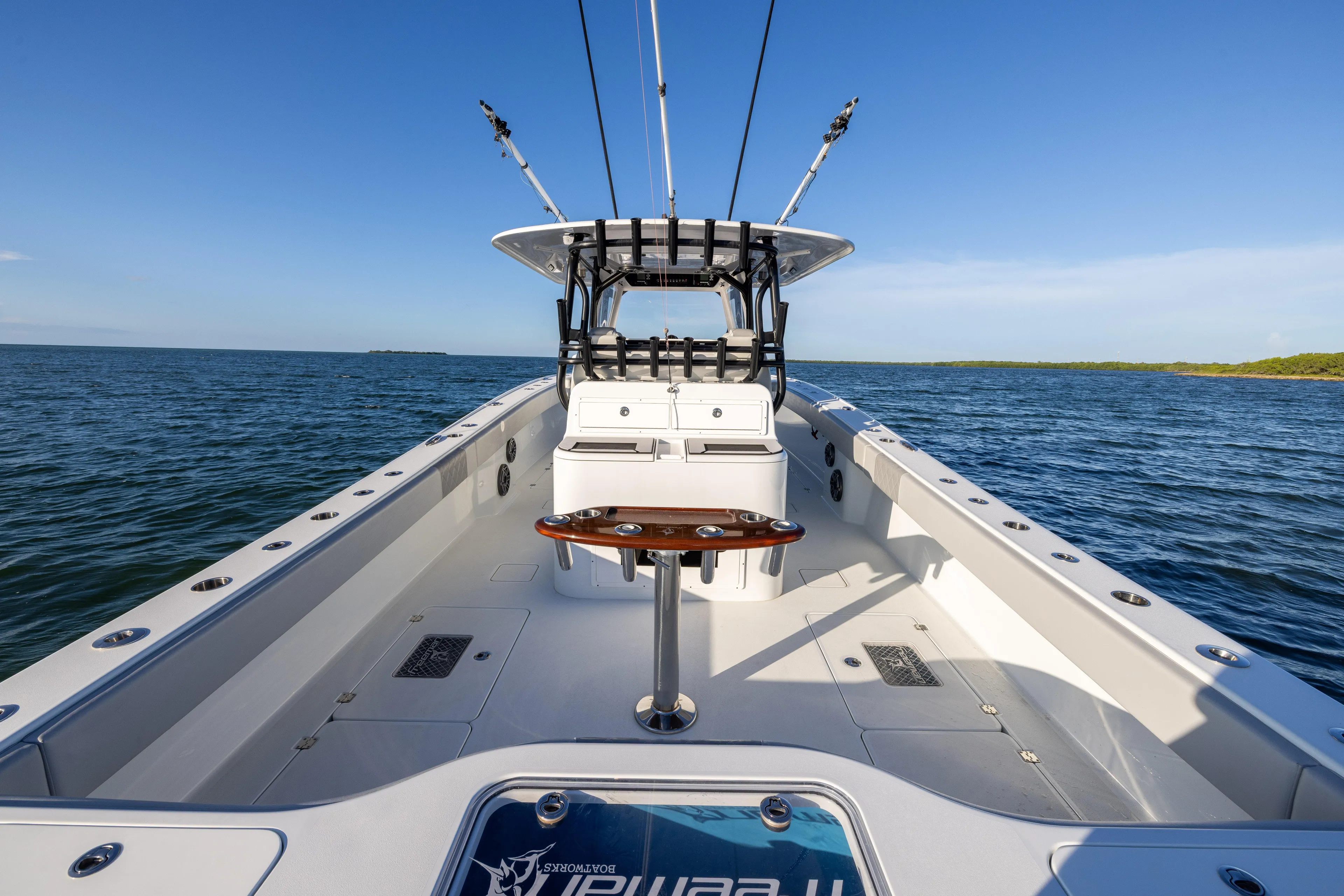  Yacht Photos Pics Freeman 37 VH 2020 boat on open water, featuring spacious deck and fishing rods.